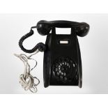 A vintage black Bakelite Ericsson telephone.