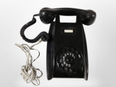 A vintage black Bakelite Ericsson telephone.