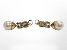 A pair of 18ct gold pearl earrings set with diamonds. CONDITION REPORT: 8.3g gross.