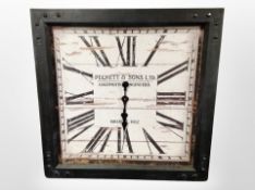 A contemporary decorative metal-framed quartz wall clock, width 80cm.