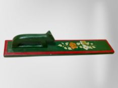 An early 20th century Scandinavian painted pine mangle board, length 66cm.