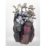 Several golf bags containing assorted drivers and irons including Dunlop, Palmer,