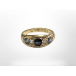An 18ct yellow gold sapphire and diamond ring, size O/P. CONDITION REPORT: 4.1g.