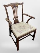 A 19th century carved armchair in the Chinese Chippendale style with tapestry drop-in seat