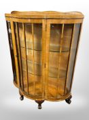 An Art Deco burr walnut bow-fronted china cabinet,