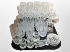 A set of 12 crystal champagne flutes, further set of 7 tumblers, crystal knife rests, etc.