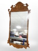 A reproduction burr walnut framed mirror, height 95cm.