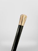 A Victorian ebonised walking cane with 9ct gold pommel, hallmarked Birmingham 1849, length 85cm.