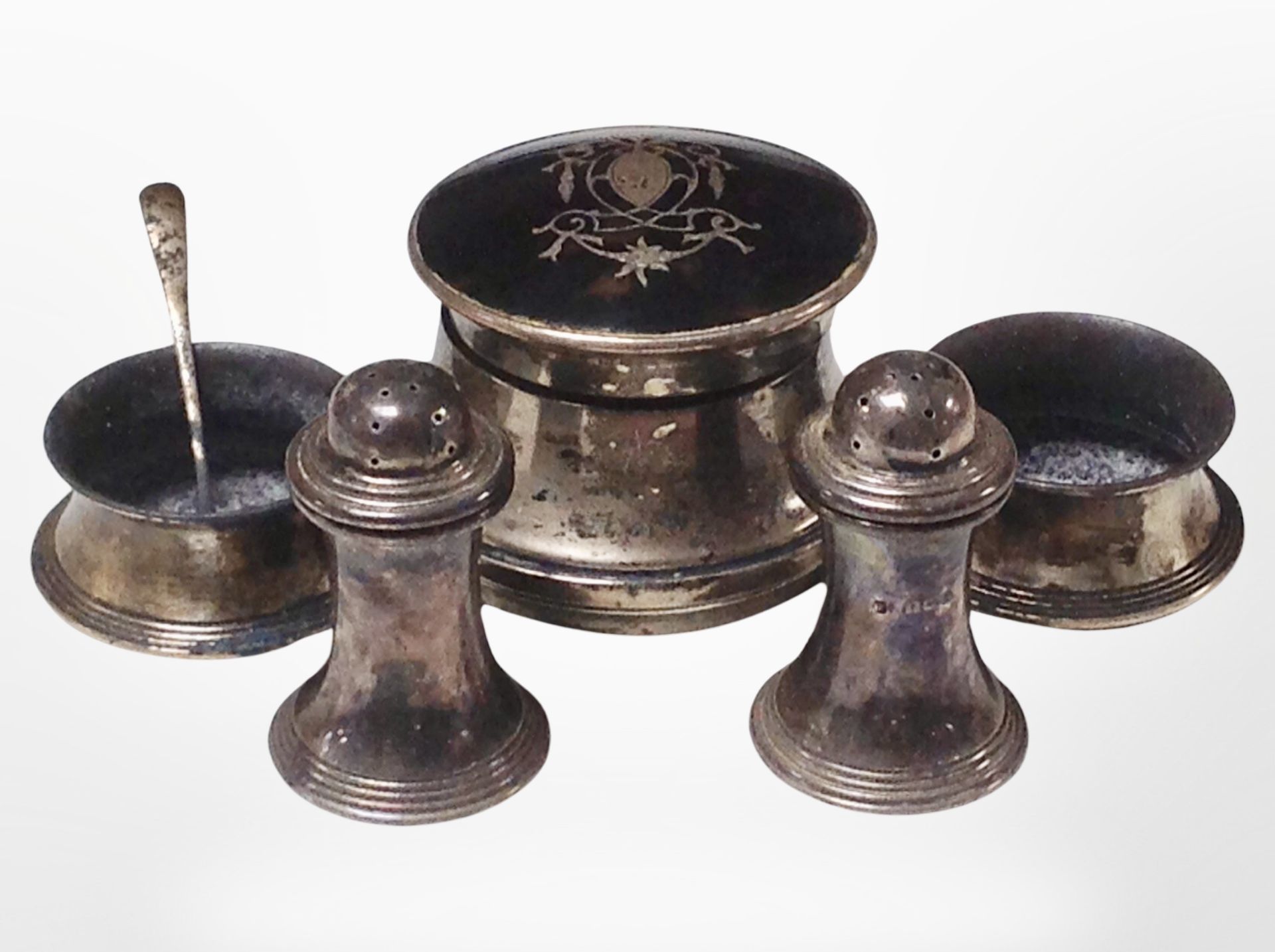 A silver and tortoiseshell-topped inkwell, together with a pair of salts, a pair of sifters,