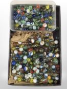 A collection of mainly glass marbles.