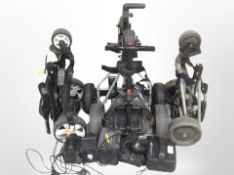 Group of folding electric golf trollies with assorted batteries