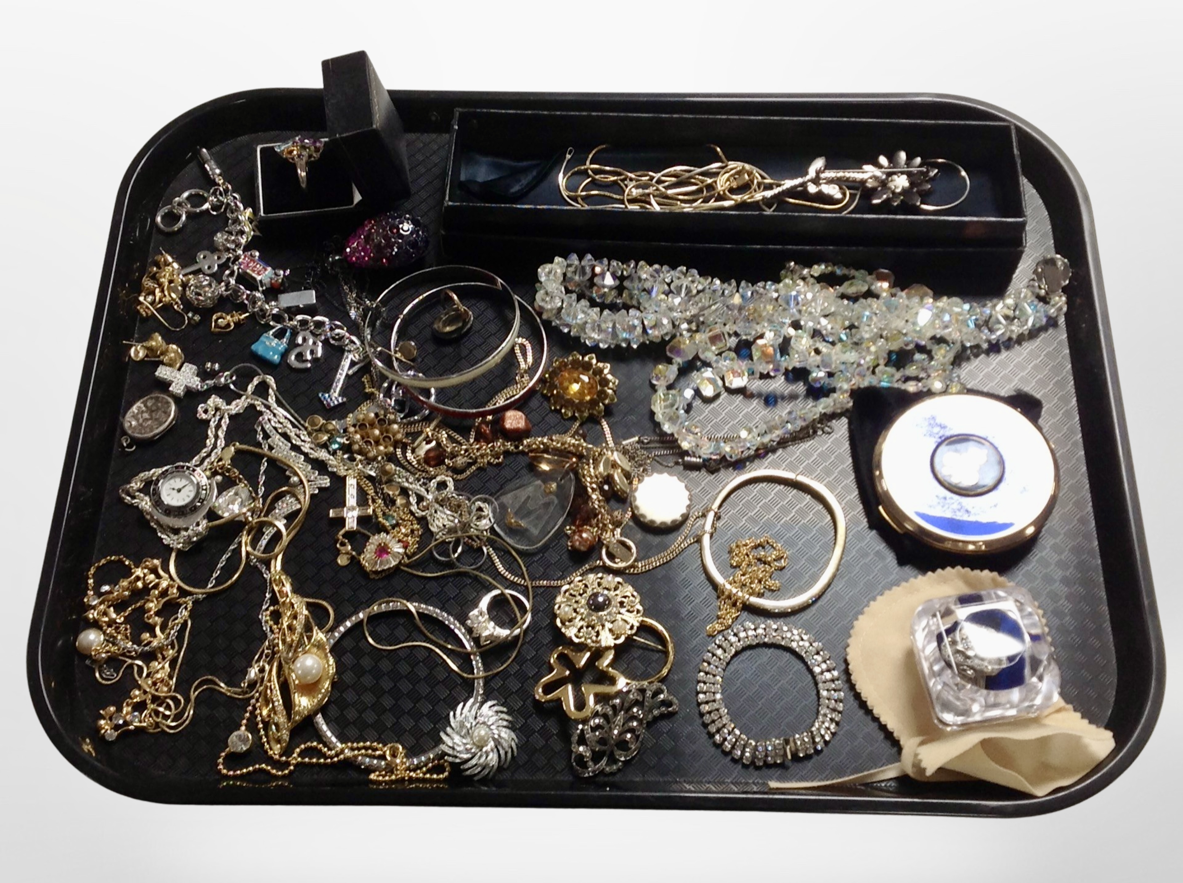 A group of costume jewellery, silver gem-set cluster ring, silver lockets, compact gilt chains,