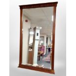 A reproduction mahogany bevelled wall mirror,