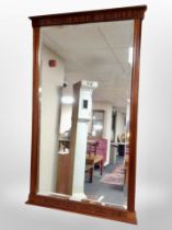 A reproduction mahogany bevelled wall mirror,