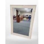 A contemporary oak framed overmantel mirror,