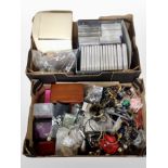 Two boxes containing costume jewellery, CDs and VHSs relating to jewellery design,