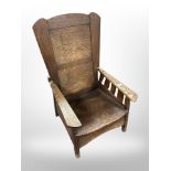 A late 19th century American style Arts and Crafts child's oak armchair