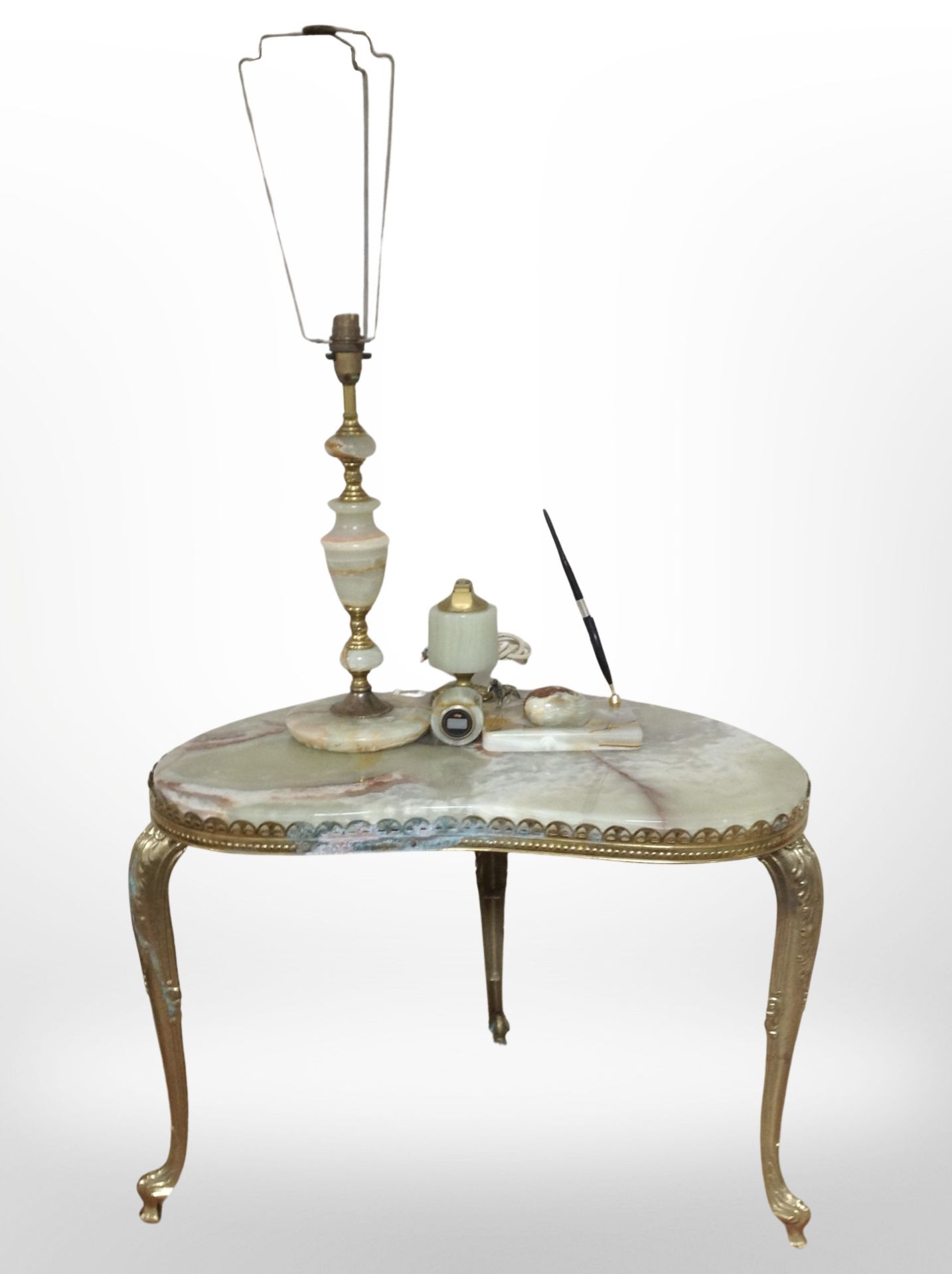 An onyx and gilt metal kidney-shaped occasional table, together with further table lamp, desk stand,