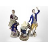 A pair of 19th century Bavarian porcelain figures of a lady and gentleman,