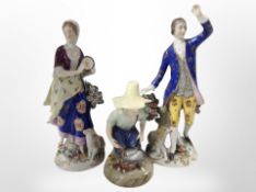 A pair of 19th century Bavarian porcelain figures of a lady and gentleman,