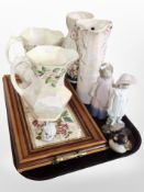 Four Maling lustre jugs, two Nao figures of girls, a tile-inset serving tray with brass handles,