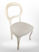 A cream painted balloon back chair