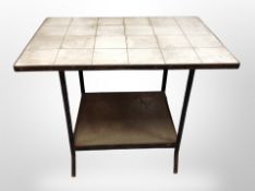 An early 20th century tiled topped kitchen preparation table,