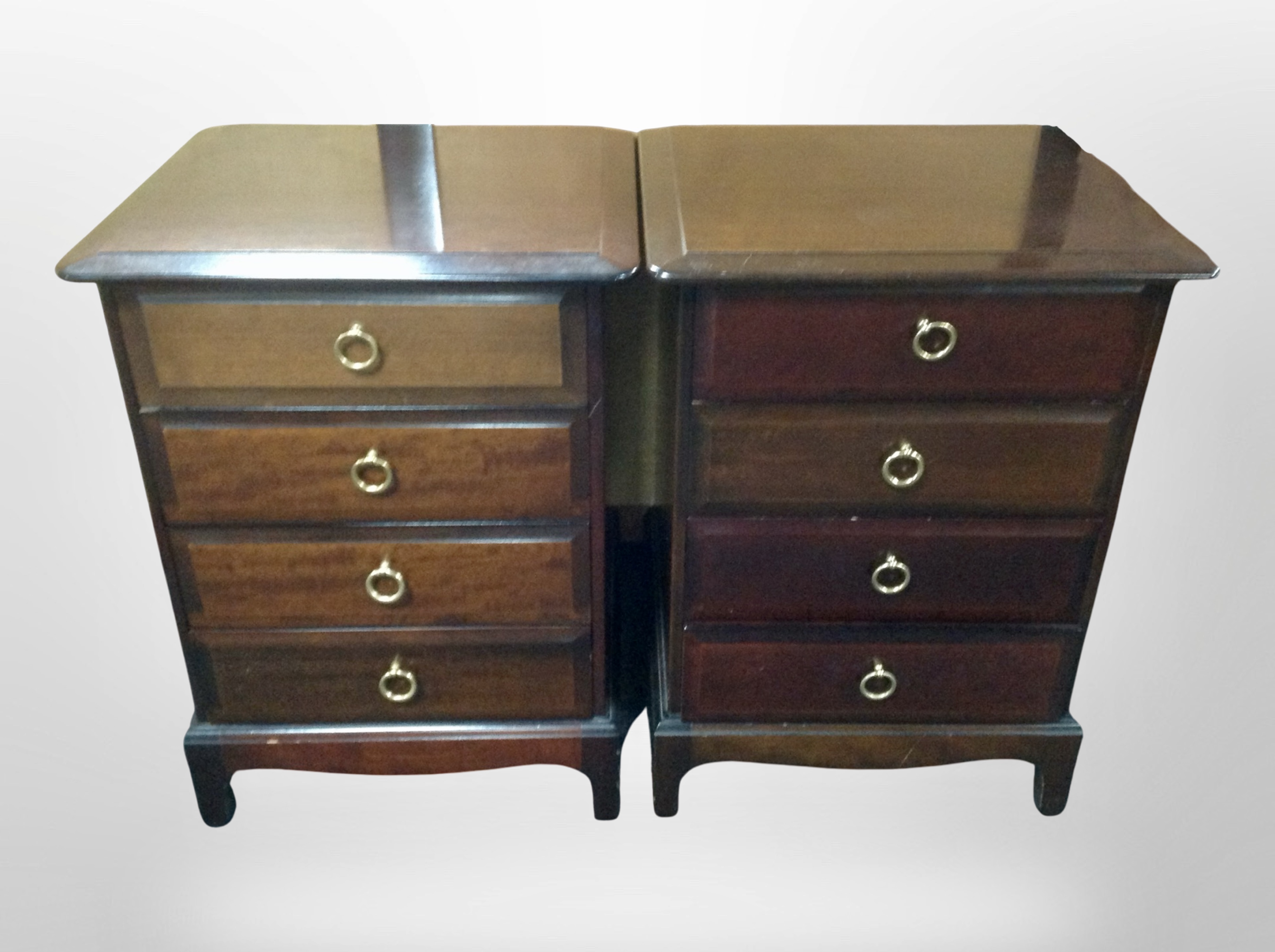 A pair of Stag Minstrel four-drawer bedside stands, width 53cm.