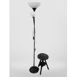 A contemporary standard lamp and a small ebonised tripod stool