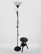 A contemporary standard lamp and a small ebonised tripod stool
