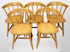 A set of five pine dining chairs