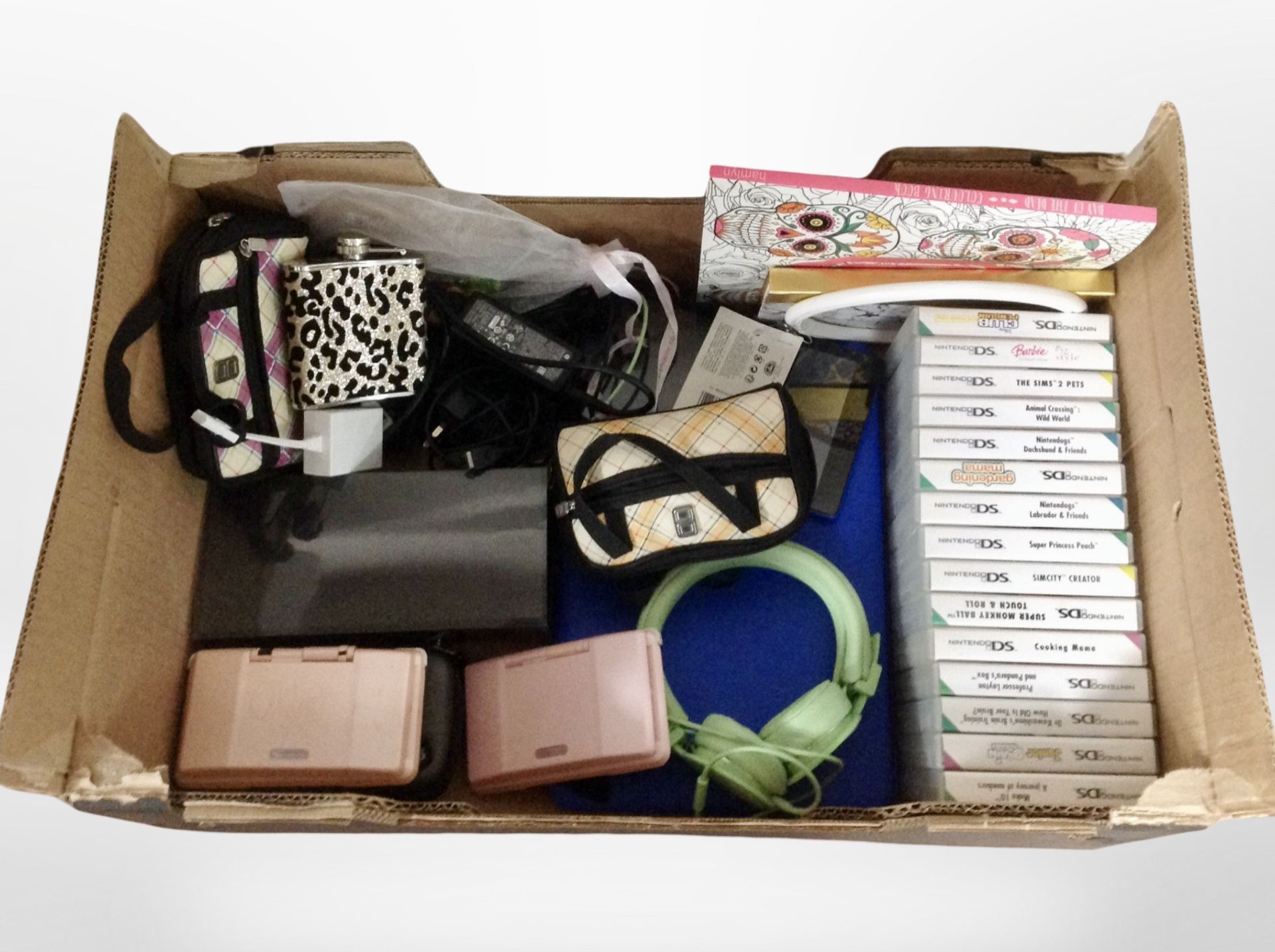 A box of Nintendo DS console games, pair of headphones, etc.