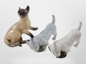 Two Royal Copenhagen figures of terriers, and a further Siamese cat (3).