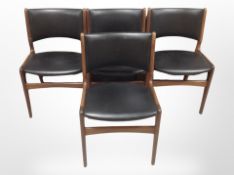 A set of four 20th century Danish teak and black vinyl dining chairs