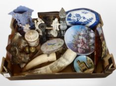 A box containing collectors plates, petrol glass bowl, cow horn, ornaments, pictures.