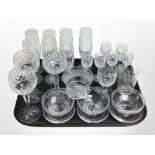 A set of 7 crystal champagne flutes, further drinking glasses, etched grapefruit bowls.