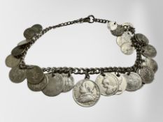 A silver watch chain with suspended Georgian and later silver coins etc.