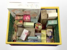A crate containing assorted fragrances and cosmetics.