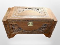A Chinese carved camphor wood blanket chest,