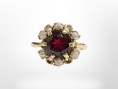 A 14ct yellow gold cluster ring set with synthetic ruby, size K.