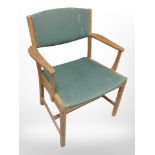 A 20th century Danish teak-framed armchair with green fabric seat, width 64cm.