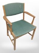 A 20th century Danish teak-framed armchair with green fabric seat, width 64cm.