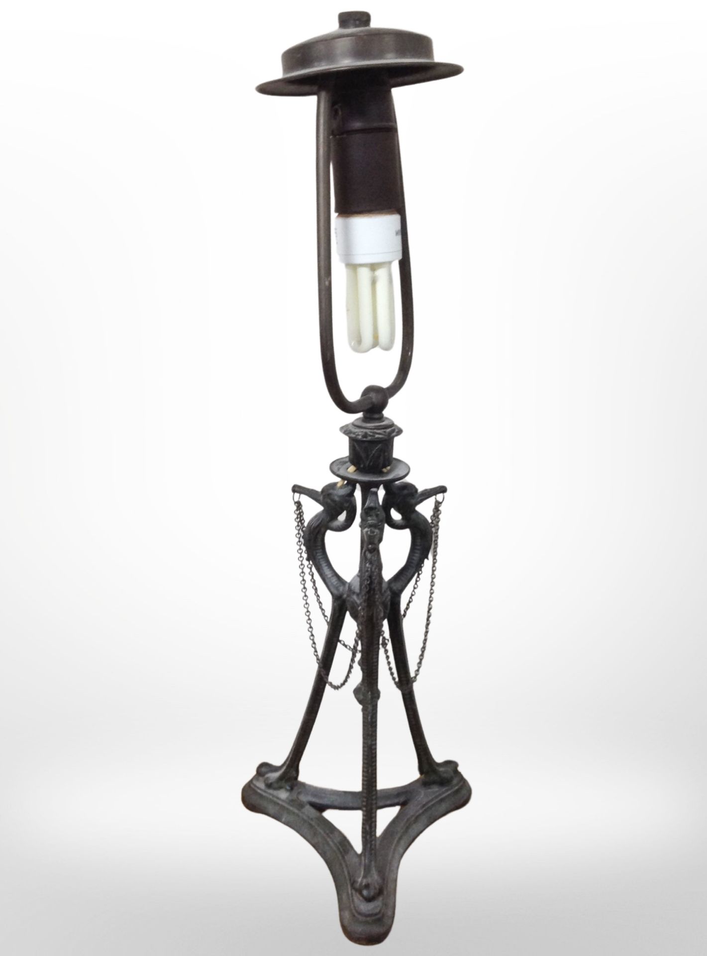 A continental patinated metal lamp base modelled as three birds, height 58cm.