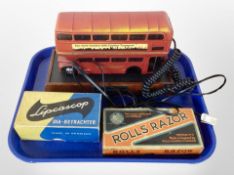 A novelty telephone handset in the form of a bus, together with a Rolls razor in box,