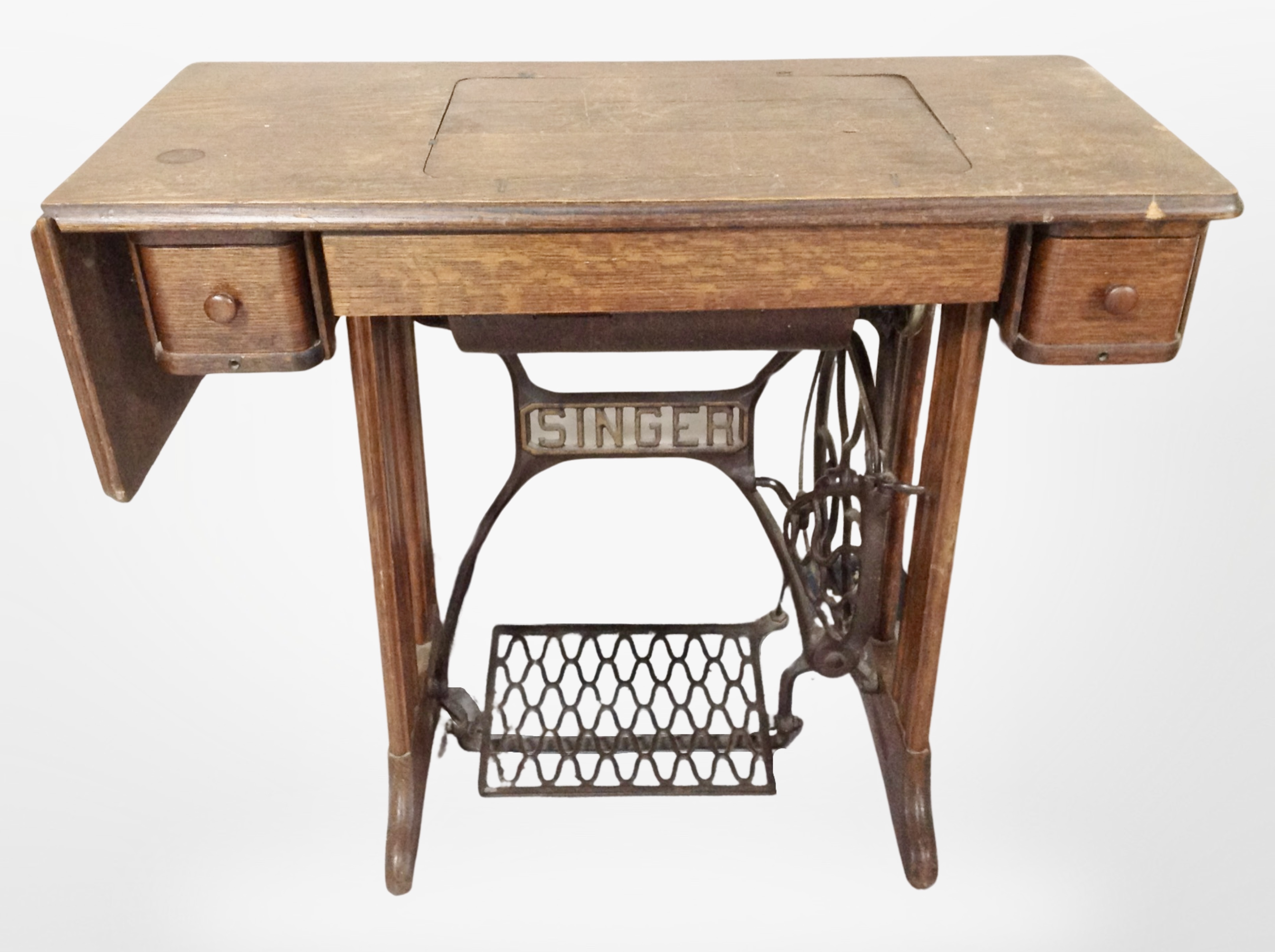 An oak Singer treadle sewing machine