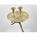 An Indian engraved brass tray on stand, diameter 57cm, together with a further pair of vases.