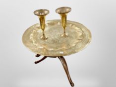 An Indian engraved brass tray on stand, diameter 57cm, together with a further pair of vases.