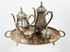 A silver-plated four-piece tea service on twin-handled tray.