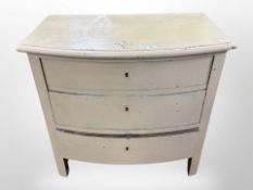 A 19th century Scandinavian painted pine bow-front three drawer chest,