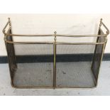 A 19th century brass fire guard,